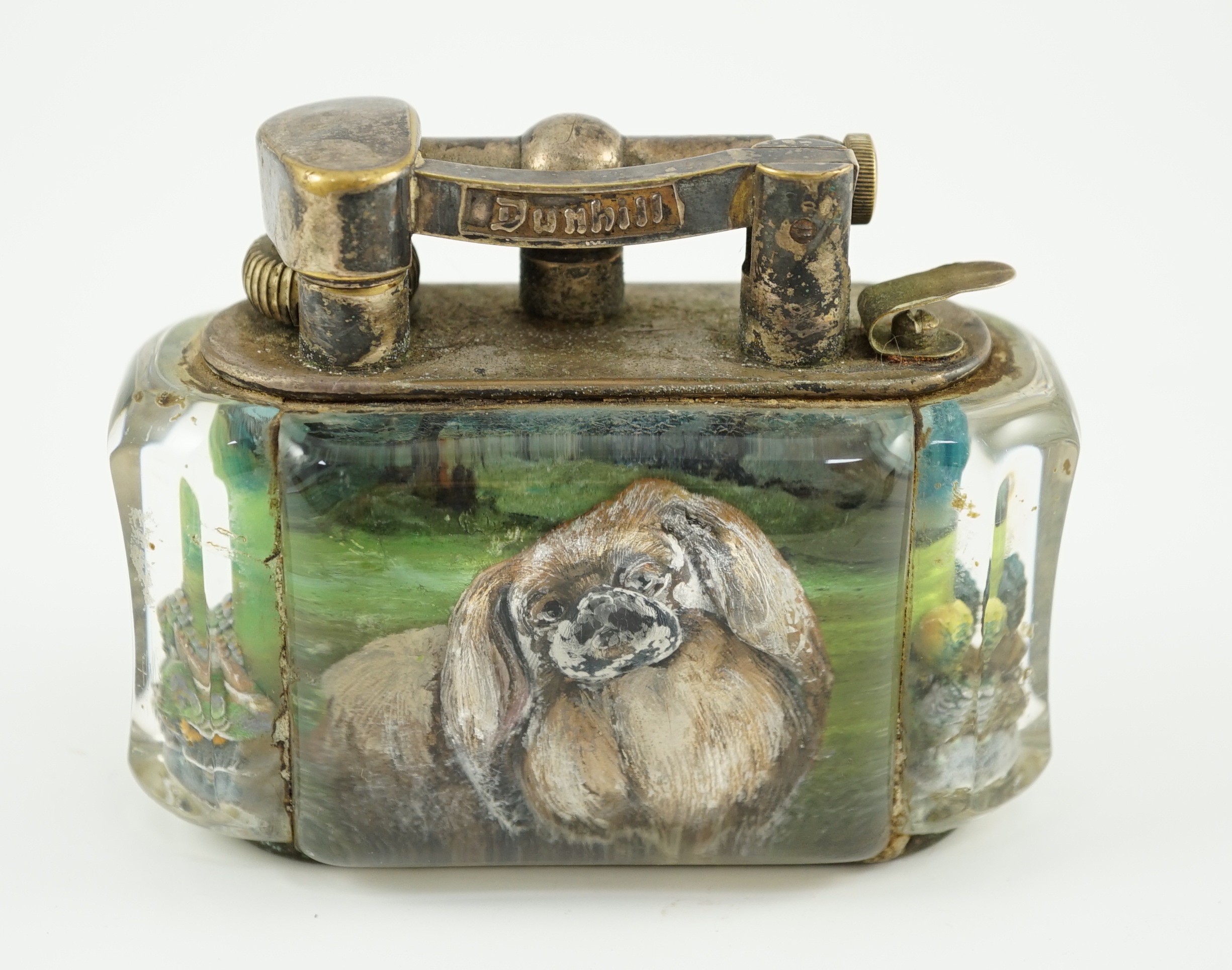 A rare Dunhill lucite cigarette lighter with unusual decoration of a Pekingese dog, width 10cm depth 5cm height 7.5cm